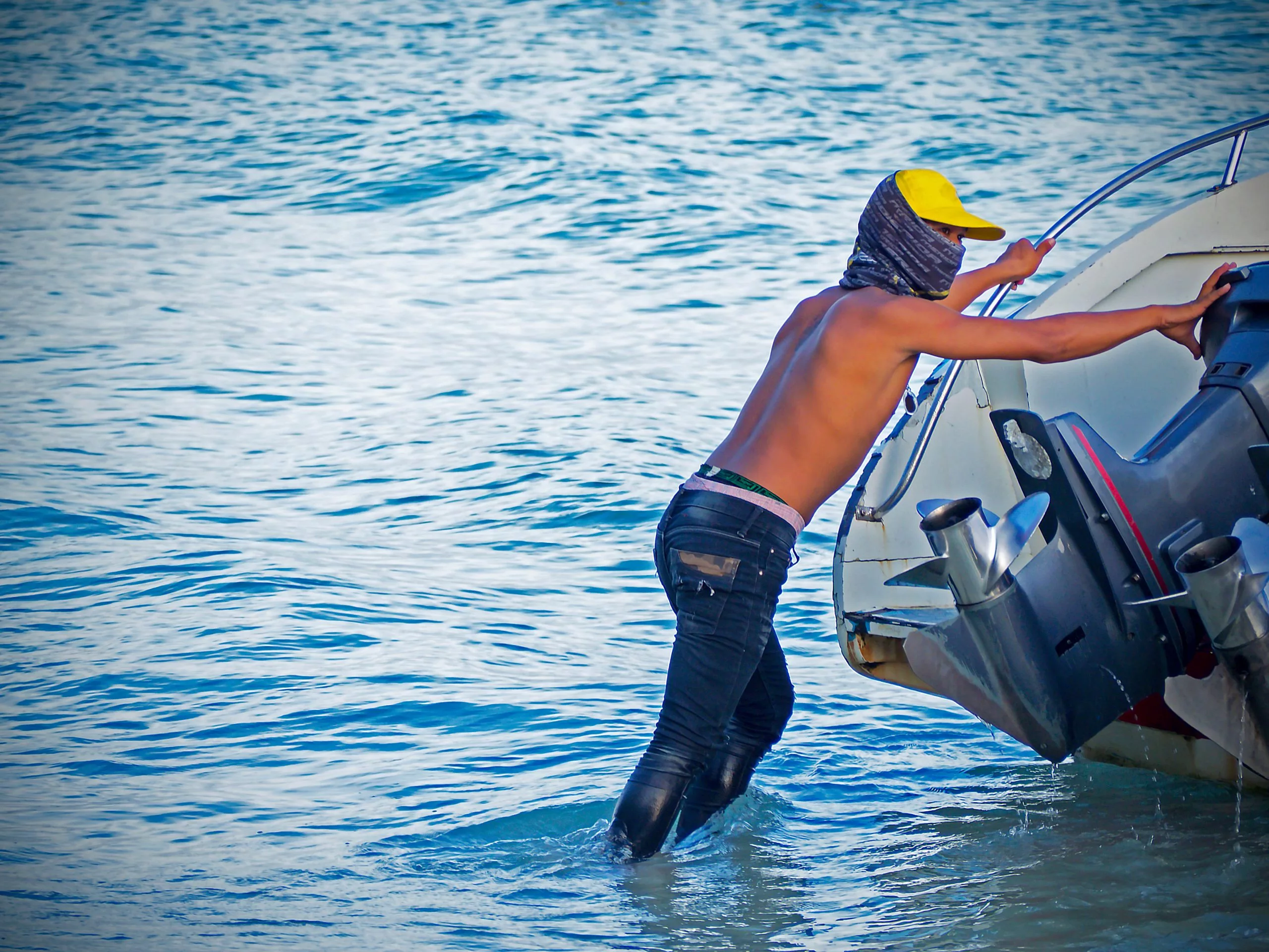 Young terrorist on water transport in asia. criminal concept. Co